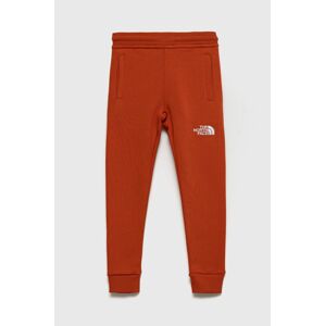 Dětské bavlněné kalhoty The North Face oranžová barva, s aplikací